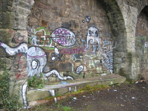 Retaining wall at top of India Street bank and below Doune Terrace Gardens.